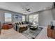 Bright living room with backyard access, hardwood floors, recessed lighting, and stylish decor, creating a comfortable living space at 6491 Wild Blue Ct, Las Vegas, NV 89135