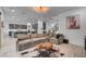 The inviting living room flows into the modern kitchen with island seating, perfect for entertaining guests at 6491 Wild Blue Ct, Las Vegas, NV 89135