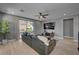 Bright living area with backyard access, hardwood floors, recessed lights, and stylish decor, blending indoor and outdoor living at 6491 Wild Blue Ct, Las Vegas, NV 89135