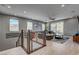 Open living room featuring hardwood floors, recessed lights, and a sliding door with backyard access, creating a seamless indoor-outdoor flow at 6491 Wild Blue Ct, Las Vegas, NV 89135