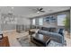 A cozy living room area with hardwood floors, recessed lighting, and mountain-themed artwork, creating an inviting space at 6491 Wild Blue Ct, Las Vegas, NV 89135