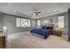 Serene main bedroom featuring hardwood floors, recessed lighting, and a tray ceiling, creating a comfortable and stylish retreat at 6491 Wild Blue Ct, Las Vegas, NV 89135