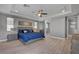 Spacious bedroom featuring a ceiling fan, wood floors, and a barn door to the bathroom at 6491 Wild Blue Ct, Las Vegas, NV 89135
