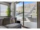 Inviting patio area with comfortable seating, offering seamless access to a backyard featuring scenic mountain views at 6491 Wild Blue Ct, Las Vegas, NV 89135