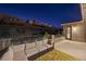 Comfortable outdoor seating area with a large sectional sofa and outdoor rug at 6491 Wild Blue Ct, Las Vegas, NV 89135