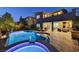 A luxurious backyard featuring a pool and spa with an outdoor living space, perfect for entertaining at 6491 Wild Blue Ct, Las Vegas, NV 89135