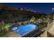 Inviting pool and jacuzzi offer a relaxing outdoor experience with manicured landscaping at 6491 Wild Blue Ct, Las Vegas, NV 89135