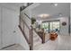 A bright entryway with staircase that leads to a large living room and backyard pool at 6491 Wild Blue Ct, Las Vegas, NV 89135