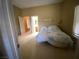 Comfortable bedroom with soft lighting, carpet flooring, and natural sunlight at 6628 Martinsville Pl, Las Vegas, NV 89110