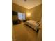 Bedroom with a cozy bed, tv, and a well-lit window at 6628 Martinsville Pl, Las Vegas, NV 89110