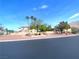 Street view showcasing the community's benches, plants, and attractive landscaping at 6628 Martinsville Pl, Las Vegas, NV 89110