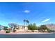 Scenic view of a community featuring well-maintained landscaping and mountain views in the background at 6628 Martinsville Pl, Las Vegas, NV 89110