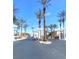 Picturesque community entrance with towering palm trees and elegant pergola structures at 6628 Martinsville Pl, Las Vegas, NV 89110