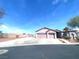 Charming single-story home with a spacious driveway and a well-manicured front yard at 6628 Martinsville Pl, Las Vegas, NV 89110