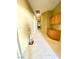 Long hallway features neutral carpet, wall storage, and light-colored walls at 6628 Martinsville Pl, Las Vegas, NV 89110