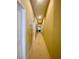 Bright hallway with neutral carpet and paint leads to bedrooms at 6628 Martinsville Pl, Las Vegas, NV 89110