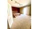 Bright main bedroom features a decorative wood-frame bed, and outdoor access at 6628 Martinsville Pl, Las Vegas, NV 89110
