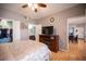 Cozy bedroom features a ceiling fan, closet space, and convenient access to the attached bathroom and other living areas at 6650 W Warm Springs Rd # 1079, Las Vegas, NV 89118
