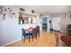 Open dining area features a modern table set and a view into the adjacent, stainless steel appliance-equipped kitchen at 6650 W Warm Springs Rd # 1079, Las Vegas, NV 89118