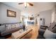 Spacious living room with hardwood floors that opens to the dining and kitchen areas at 6650 W Warm Springs Rd # 1079, Las Vegas, NV 89118
