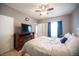 Comfortable main bedroom featuring a ceiling fan and large window with lots of light at 6650 W Warm Springs Rd # 1079, Las Vegas, NV 89118