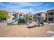 A vibrant playground with slides and climbing structures, perfect for Gathering fun in a shared outdoor space at 6650 W Warm Springs Rd # 1079, Las Vegas, NV 89118
