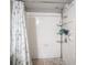 Shower featuring a tile surround and lots of built-in shelving at 6650 W Warm Springs Rd # 1079, Las Vegas, NV 89118
