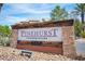 Elegant entrance sign for Pinehurst Condominiums with stonework and manicured landscaping at 6650 W Warm Springs Rd # 1079, Las Vegas, NV 89118