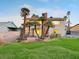 Spacious backyard with lush lawn and mature palm trees that enhance this home's appeal and outdoor living space at 6712 Kittery Dr, Las Vegas, NV 89107
