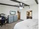 Bright bedroom with a ceiling fan, TV and desk area at 6712 Kittery Dr, Las Vegas, NV 89107