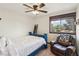 Comfortable bedroom with a single bed, window with a view, and a leather chair and pillow at 6712 Kittery Dr, Las Vegas, NV 89107