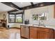 A modern kitchen sink area with stainless steel appliances and a view of the backyard at 6712 Kittery Dr, Las Vegas, NV 89107