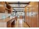 Spacious kitchen features wood floors, a built-in desk, and ample storage cabinets at 6712 Kittery Dr, Las Vegas, NV 89107