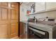 Laundry room features newer washer and dryer units and a cabinet above at 6712 Kittery Dr, Las Vegas, NV 89107