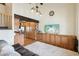 Open concept living room with beamed ceilings, custom cabinets, and an adjacent kitchen at 6712 Kittery Dr, Las Vegas, NV 89107