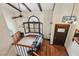 Bright living room with high ceilings, exposed beams, and a cozy seating area with natural light at 6712 Kittery Dr, Las Vegas, NV 89107