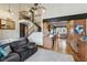 Spacious living room featuring hardwood floors, an adjacent staircase, and an open concept kitchen at 6712 Kittery Dr, Las Vegas, NV 89107