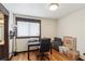 Spacious office features a desk and rolling chair with view into the bathroom at 6712 Kittery Dr, Las Vegas, NV 89107