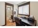 Home office features a desk with printer, a window, and the view into the bathroom at 6712 Kittery Dr, Las Vegas, NV 89107