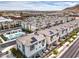 Aerial view of community featuring townhomes with solar panels and community pool at 6821 Prairie Pearl St, Las Vegas, NV 89148