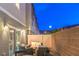 Outdoor patio with views of backyard featuring an outdoor dining and seating area at dusk at 6821 Prairie Pearl St, Las Vegas, NV 89148