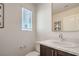 Powder room features a modern faucet, white counter, and dark wood cabinet at 6821 Prairie Pearl St, Las Vegas, NV 89148