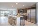 Modern kitchen with stainless steel appliances, a large island, and seating at 6821 Prairie Pearl St, Las Vegas, NV 89148