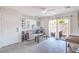 Bright living room features a ceiling fan, sliding glass doors, and neutral-toned decor for a welcoming atmosphere at 6821 Prairie Pearl St, Las Vegas, NV 89148