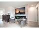 Elegant living room with a fireplace, mounted TV, and comfortable seating at 6821 Prairie Pearl St, Las Vegas, NV 89148