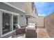 Back patio with comfortable seating and a sliding door, perfect for outdoor relaxation at 6821 Prairie Pearl St, Las Vegas, NV 89148