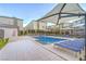 Community swimming pool area with lounge chairs and shade structures for residents' enjoyment at 6821 Prairie Pearl St, Las Vegas, NV 89148