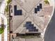Bird's-eye view of a modern home's roof featuring solar panels and meticulously maintained landscaping at 6821 Prairie Pearl St, Las Vegas, NV 89148