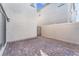 Private backyard featuring a paved patio area with gated access, perfect for outdoor dining and relaxation at 7017 Magenta Moon St, North Las Vegas, NV 89086