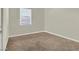 Neutral bedroom with a window at 7017 Magenta Moon St, North Las Vegas, NV 89086